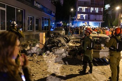 Iran war briefing: Tel Aviv bombarded in retaliation for killing security chief