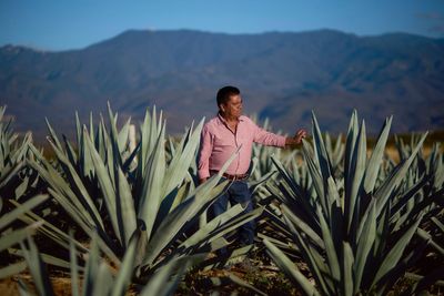 Mezcal producers in Oaxaca pose for photos while reflecting on economic impacts of the drink
