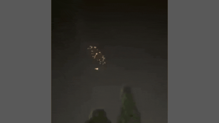 Watch: Flashes in sky above central Israel in latest Iran cluster munition strike