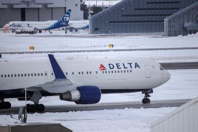 Delta flight en route to Taiwan diverted to Alaska after man made racial slurs to flight attendants, feds say