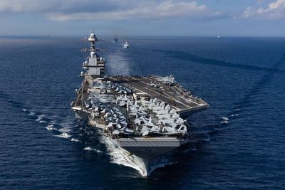 US aircraft carrier to go to port after fire and ‘blocked toilets’ in Middle East