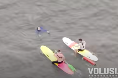 Police on paddleboards chase suspect after he leapt into water to evade arrest