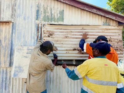 ‘Eerily silent’: Cape York residents batten down the hatches ahead of Tropical Cyclone Narelle’s arrival
