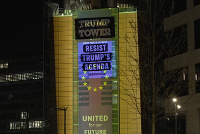 Greenpeace projects golden ‘Trump Tower’ onto European Commission HQ in Brussels
