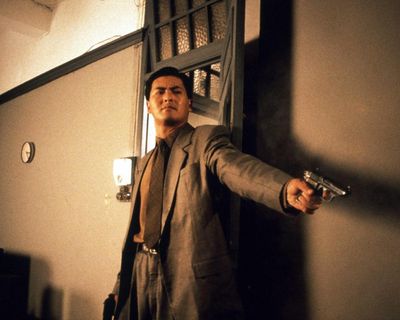 The Killer review – John Woo’s gun-filled melodrama remains a blood-soaked classic
