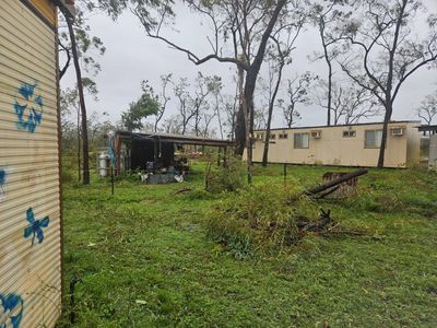 ‘Cyclone-hardened’ Queenslanders shelter in shipping containers as ‘bloody horrendous’ Narelle tears through