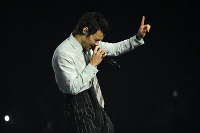 Harry Styles remains at number one on album chart for a second week