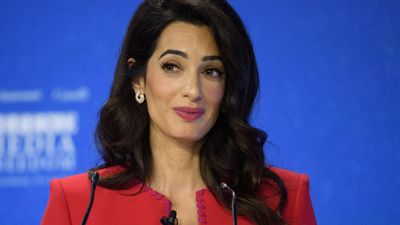 Amal Clooney’s striking red pencil dress is a masterclass in styling spring’s boldest colour