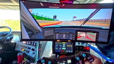 Truck driver replaces passenger seat with $6,000 sim driving rig, uses it to kill time while "stuck in traffic"