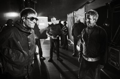 Liam and Noel Gallagher shown having a laugh in Oasis tour photography book