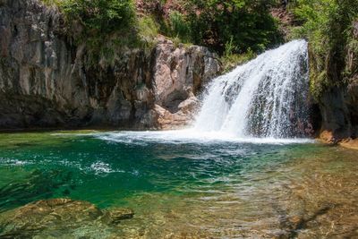 Man dies after jumping from 15-foot waterfall and being pulled under
