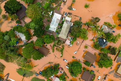 Hawaii digs out from another round of flooding after a surprise downpour, in photos