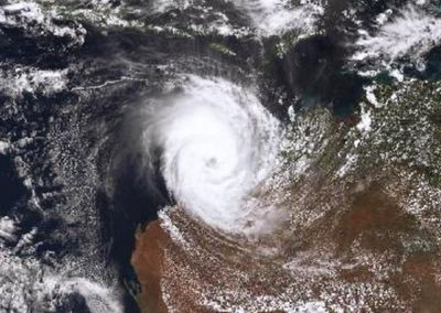 Tropical Cyclone Narelle intensifies off WA as it continues rare path across Australia