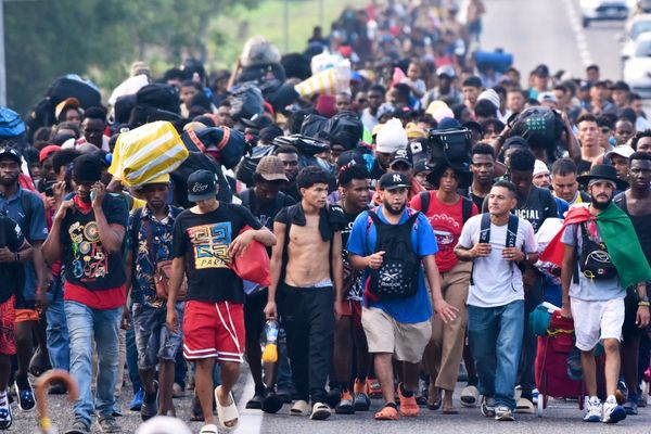 Migrants march from southern Mexico, protesting delays and seeking papers to work