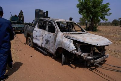 Militants in northern Nigeria kill 10 security forces and 1 resident, officials say