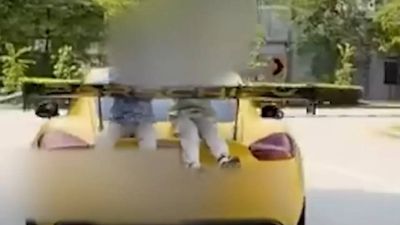 Indian-origin man charged in Singapore for driving car with children on rear boot