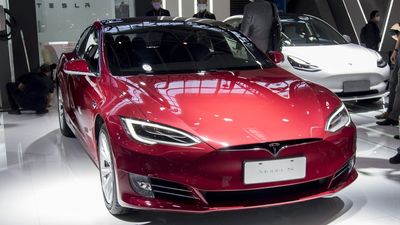 This intrepid bug bounty hunter is splicing together Tesla parts from crashed cars, and has somehow managed to build a semi-working computer system on their desk