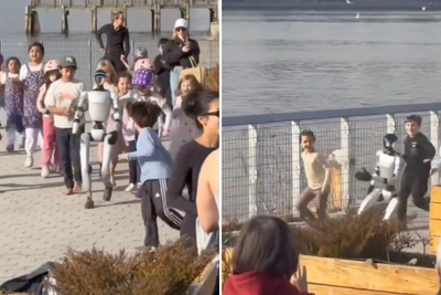 Humanoid robot is chased by excited children after it appears in New York park