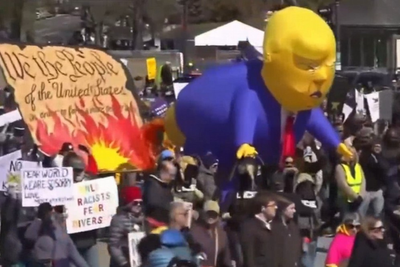 ‘No Kings’ protesters parade effigy of Trump defecating on US Constitution