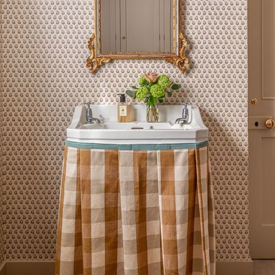 This simple tweak is the ultimate way to add storage to a pedestal sink – it's a game-changer for adding character to a bathroom