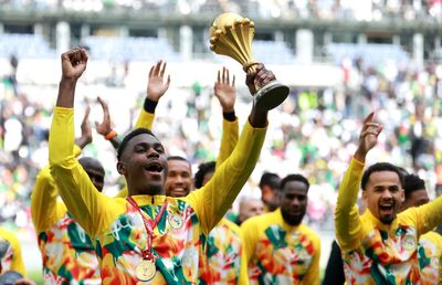 Defiant Senegal parade AFCON trophy despite being stripped of title