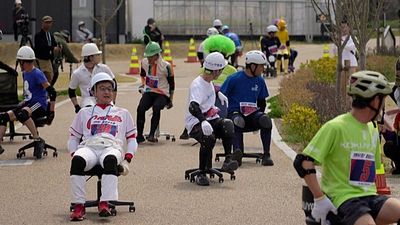 Office chair Grand Prix rolls through Japanese streets