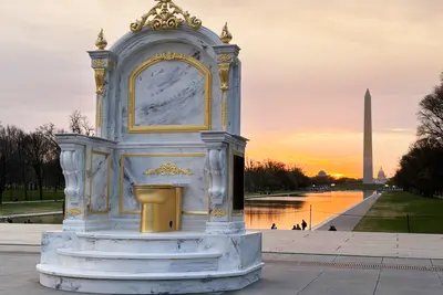Group behind Epstein-Trump statues has a new giant gold toilet sculpture installed on the National Mall