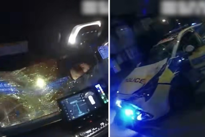Two-tonne stolen Land Rover reverses over pursuing police car