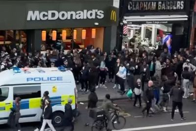 Pregnant woman shelters as teenagers storm Clapham High Street in Easter holiday chaos