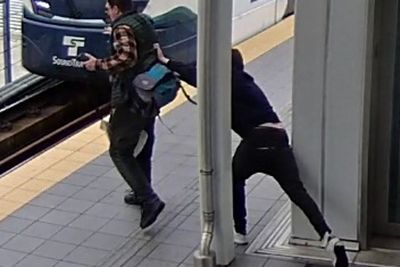 Every commuter’s worst nightmare as video shows stranger creep up and shove man in front of train