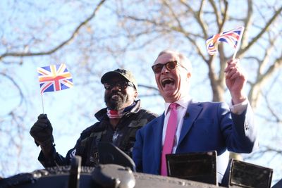 Derek Chisora arrives at media event in army tank with Nigel Farage