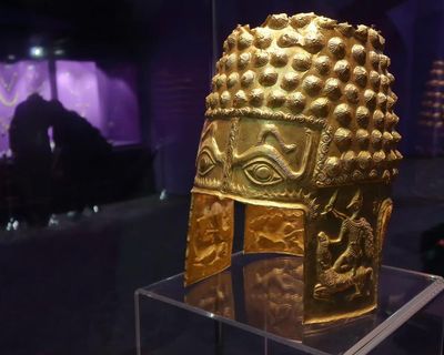 ‘A wow moment’: ancient Romanian gold helmet returned in plea deal with theft suspects
