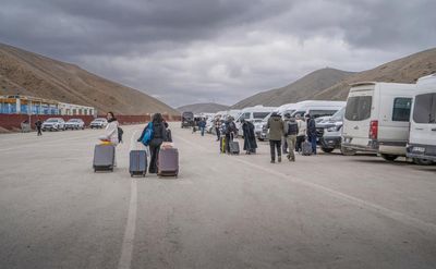 ‘Every night they are bombarding’: at border crossing, some Iranians are fleeing war and some are heading home