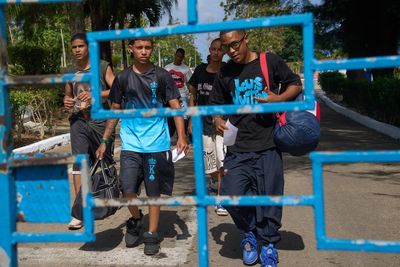 Photos of freed prisoners reuniting with families outside a Cuban prison