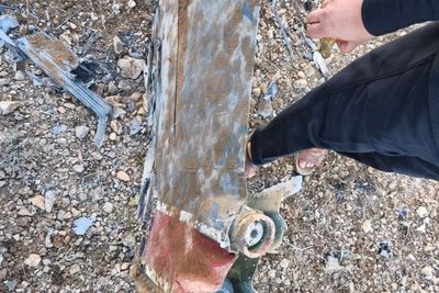 Photos show F-15 shot down in Iran as US searches for missing pilot