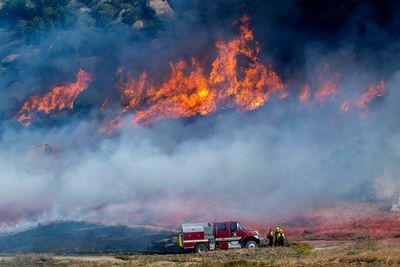 A fast-growing wildfire in windy Southern California triggers evacuations