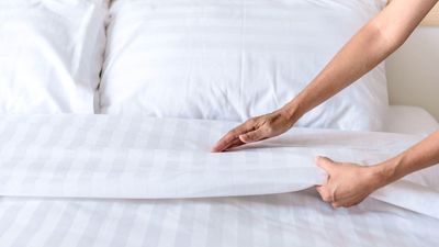 This is how luxury hotels get their bed sheets crisp, white and smelling fresh — and the secret is in your cabinets, expert says