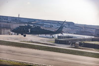 Worker for US defense contractor killed in Iraq as colleagues say they are pressured to stay