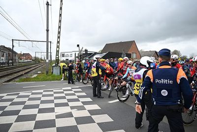 Riders who ran level crossing red light during men's Tour of Flanders could face fines and short driving bans, says Flemish prosecutor