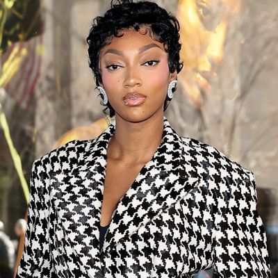 Angel Reese Enters Her Atlanta Dream Era in a Black-and-White Houndstooth Skirt Set
