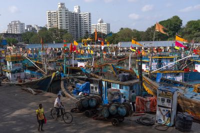 Photos show boats sitting idle at Mumbai’s historic dock as the Iran war drives up fuel costs