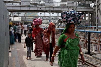 ‘We don’t want to die starving’: Indian cities see Covid-style exodus of workers as fuel crunch deepens