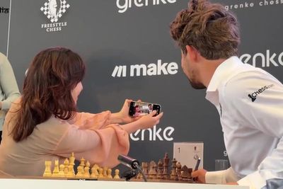 Watch: Chess player’s phone seized after rule-breaking selfie with Magnus Carlsen