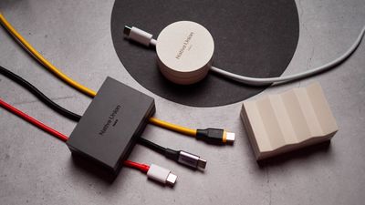 I used a $30 cable weight, and it is now my favorite desk accessory