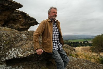 ‘That’ll be the end’: actor Sam Neill joins fight to stop controversial goldmine near his New Zealand vineyard