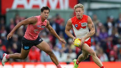 Coach in awe as Heeney steers Swans to win over Suns