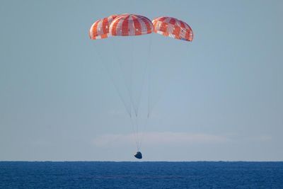 Jubilant return of Artemis II shadowed by ‘extinction-level’ cuts to Nasa: ‘It’s discordant’