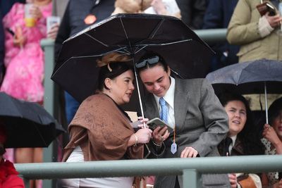 Crowds brave the elements at Aintree ahead of Grand National