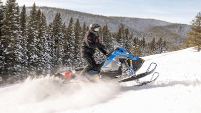 Watch As A Skier Nearly Gets Run Over By A Snowmobile, Narrowly Escaping Injury