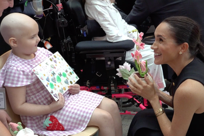 Meghan receives flowers from sick child during sweet encounter at Australian hospital